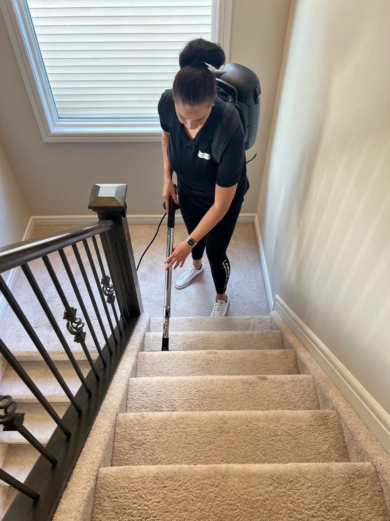 Taraima vacuuming stairs with backpack vacuum